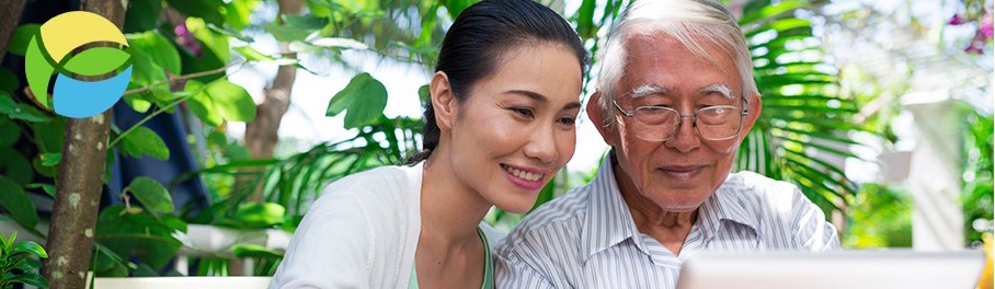 woman and her father looking at a computer